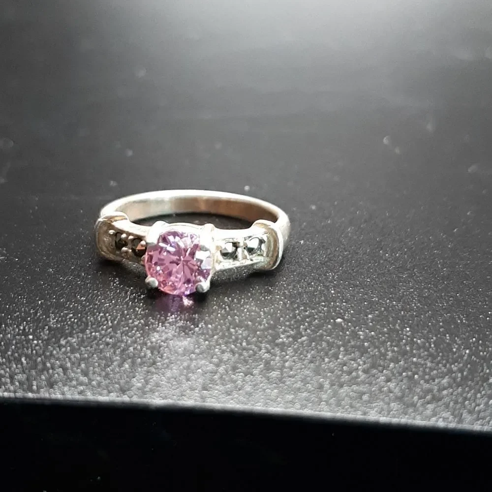 Sterling silver ring with pinkish glass stone and marcasite